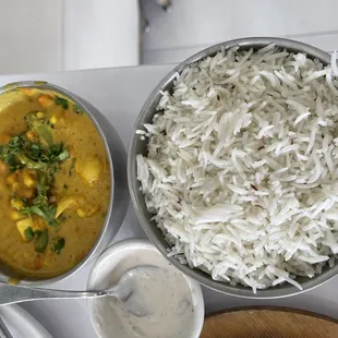 a bowl of rice and a bowl of curry