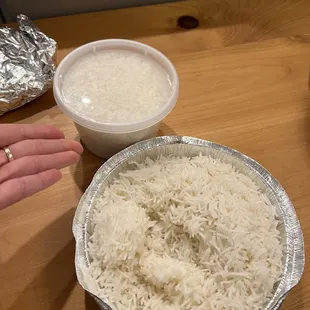 a bowl of rice and a container of rice