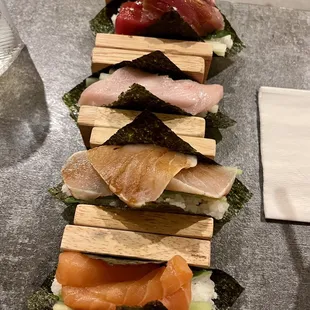 a stack of sushi on a table