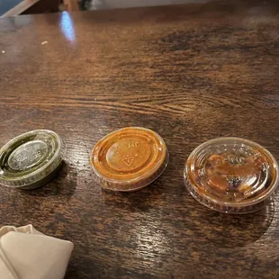 Chutneys (left to right: mint, coconut, and spicy pickled vegetables)
