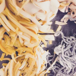 Various noodle styles and sizes .