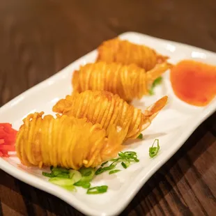 a close up of a plate of fried potatoes