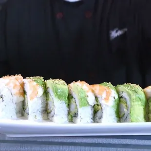 a sushi roll being prepared