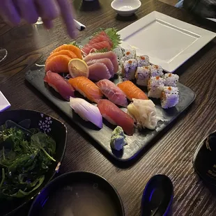 a plate of sushi and a bowl of soup