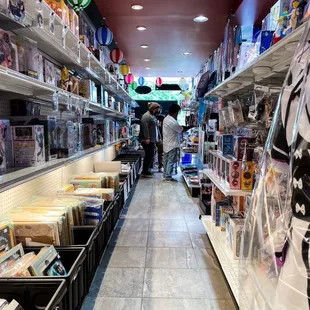 All the shelves are labeled by titles like Demon Slayer, Naruto and Jujutsu Kaisen, etc.
