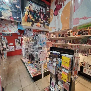 Inside the store. Lotsa different things. Figures, shirts, cards, etc.