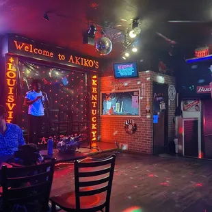 a karaoke bar with neon lights