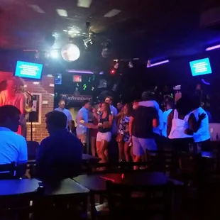 a group of people in a bar