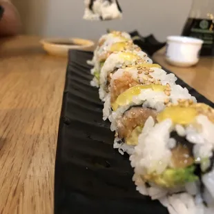a sushi roll with avocado