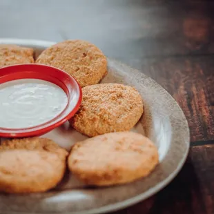 a plate of cookies with a dip