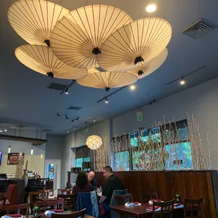 two people sitting at a table in a restaurant