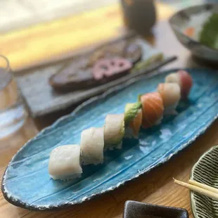 Rainbow row and eggplant at the back. Both tasted awful. Fish was not fresh. Everything was small portion and it was a extremely over priced