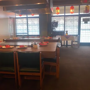 a dining room with a lot of tables and chairs