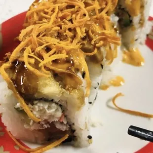 a hot dog with cheese on top