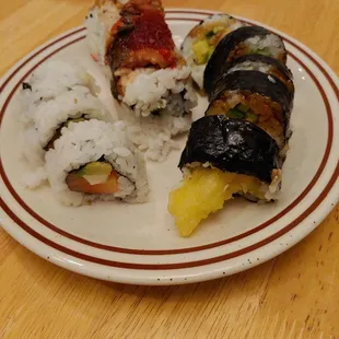 Philly roll (not sure if missing rolls or if 3 is correct), Dragon roll (supposed to be cali roll with eel on top), &amp; shrimp tempura roll.