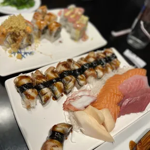 Some rolls, Eel nigiris, and Octopus, White Tuna, Salmon, Red Snapper and Tuna Sashimi