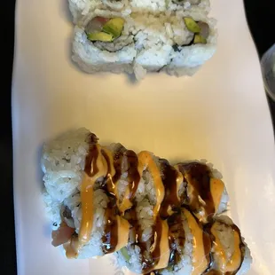 two pieces of sushi on a plate