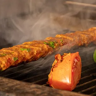 a hot dog on the grill