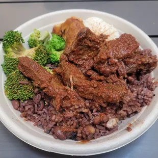 Waakye, braised stewed beef, plantains, broccoli, boiled egg