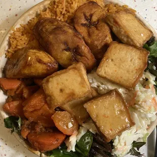 Jollof/ Kale base roasted carrots, tofu, coleslaw, plantains, and spicy honey drizzle.