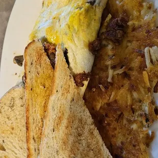 Bacon eggs hash browns and toast