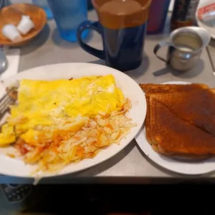 a breakfast of eggs, toast and coffee