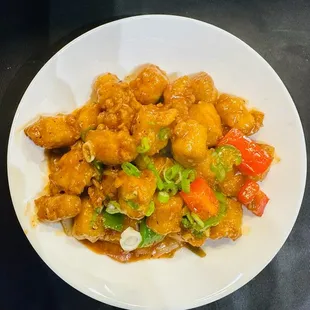 a plate of chicken and vegetables