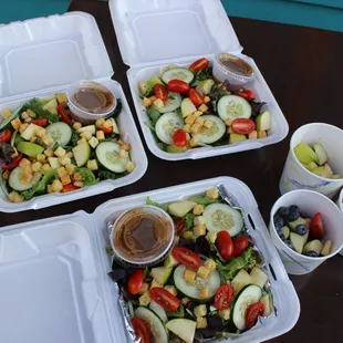 Aksum&apos;s full menu is available for take-out - salad with side of fruit