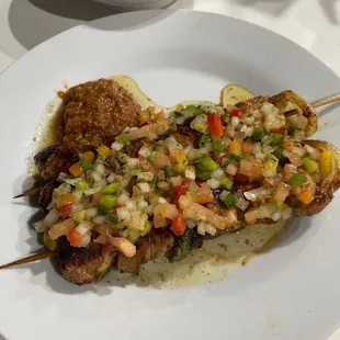 Chicken kabobs with side of rice and beans