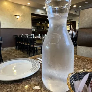a pitcher of water on a table