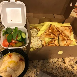 Cheese triangles, Zaatar and cheese mini pizza with hummus and veggies.