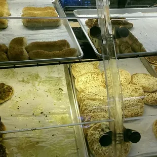 a variety of pastries in a display case