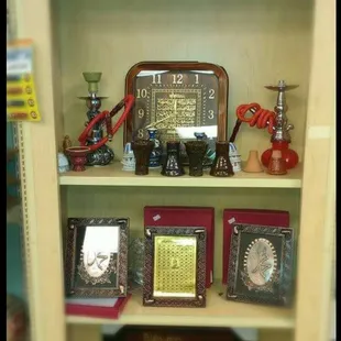a shelf with a clock and other items