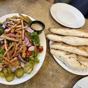 Salad and house made bread that comes with our platter