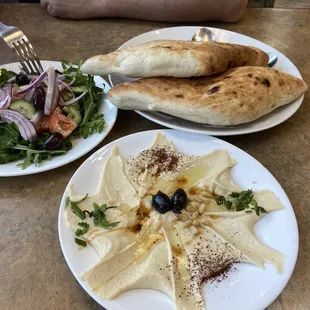 Yummy hummus and salad and house baked bread that comes with our meal