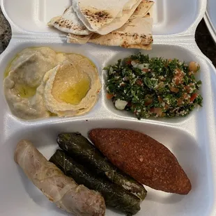 Baked Kibbeh combo with Stuffed Grape Leaves and Stuffed Cabbage Rolls + Tabouleh Salad + Baba Ghanouj and Hummus + pita bread