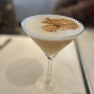 a cocktail in a martini glass