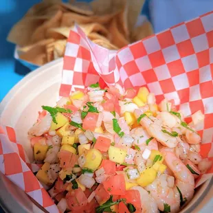 a bowl of shrimp and corn salad