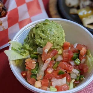 a bowl of guacamole and chips