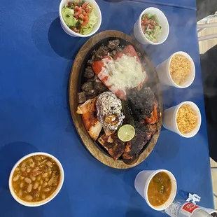 Parillada with the fixings, charro beans, rice, and guacamole