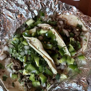Carne asada with jalapeños and onions on flour tortillas