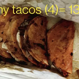 4 tiny tacos not worth 14.00$.