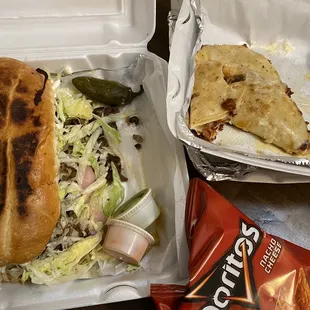 a sandwich in a styrofoam container