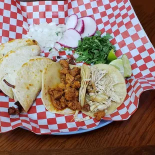 Pollo, pastor, and choriqueso tacos