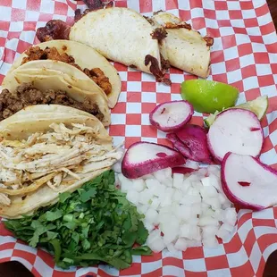 Pollo, fajita, pastor, and fajiqueso tacos.