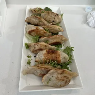 Pan Fried Dumpling stuffed with pork ( 8 pcs )