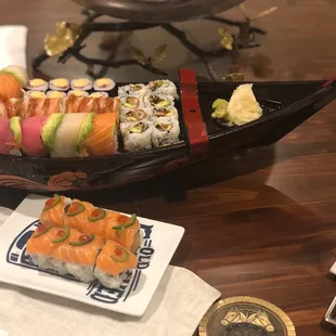 Al's special, eel cucumber roll, rainbow roll, spicy tuna, firecracker on my sushi boat to make take out more fun to eat at home!