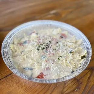 a bowl of soup on a wooden table