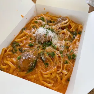 Linguine with pink sauce, spinach, garlic, and meatballs