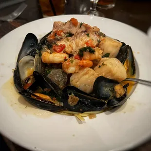 FRUTTI di MARE - Sautéed mussels, little neck clams, shrimp, scallops, calamari and lobster meat in a spicy marinara sauce